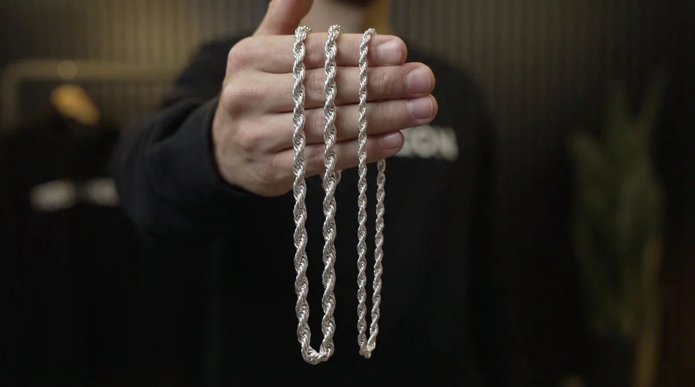 Photo - Hand displaying two silver rope chains highlighting hollow vs solid rope chain differences